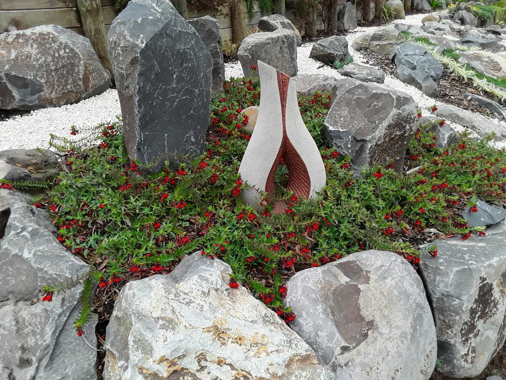 Cuphea 'Tiny Mice' plant in a garden.