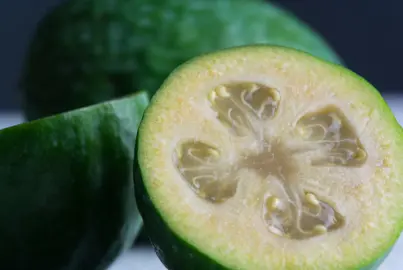 Feijoa Apollo fruit cut in half.